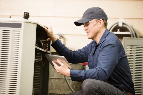 technician installing hvac system