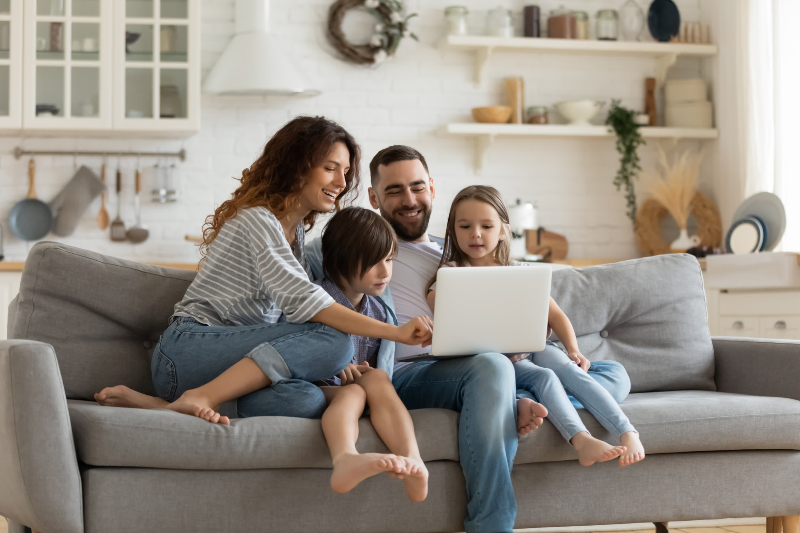 family on couch enjoying each others company