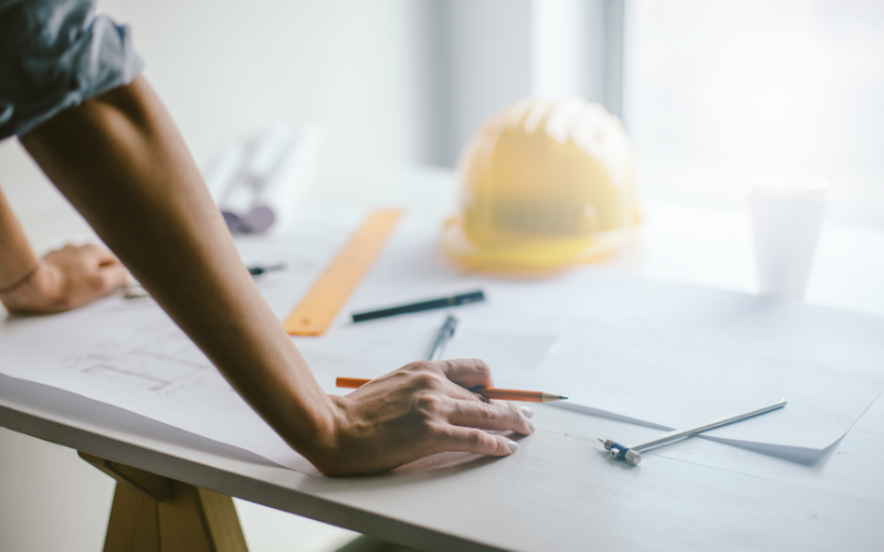 builder looking over plans