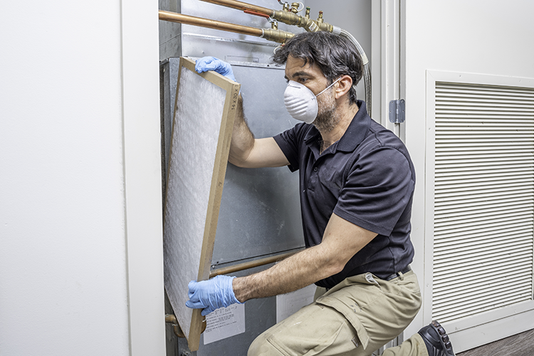 commercial air conditioning technician installing unit