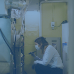faded image of a female tech inspecting a furnace