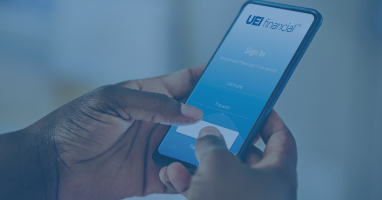 two hands signing in to the UEI financial app