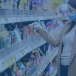 Woman wearing a mask shopping in a grocery store.